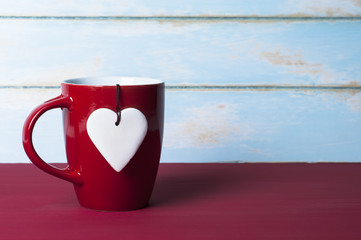 White heart with red mug. Valentines concept.