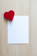 Red heart with white card. Love and Valentines concept.
