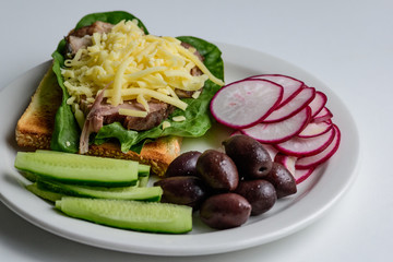 healthy breakfast, toast with meat and vegetables