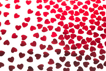 Valentines day pattern of red hearts confetti on white background. Festive Valentine.