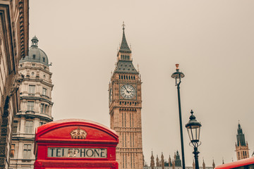 Fototapeta na wymiar Big Ben in London, England and famous red telephone cabin