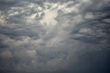 Fototapeta na wymiar Dark dramatic clouds in the sky before the storm.