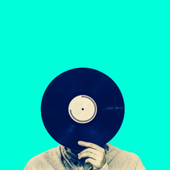 man holding record, isolated on green. art filter, music background