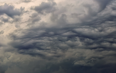 Fototapeta na wymiar Dark dramatic clouds in the sky before the storm.