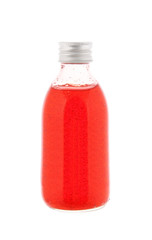 Close up on a medicine bottle with red syrup isolated on a white