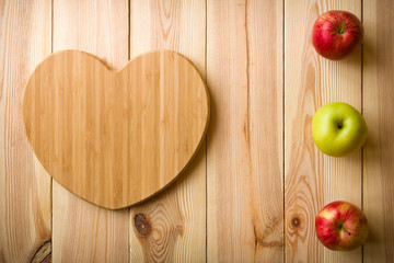 Healthy Food - Heart shaped cutting board with apples