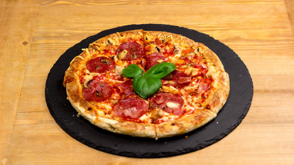 Delicious italian pizza served on wooden table