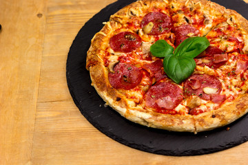 Delicious italian pizza served on wooden table