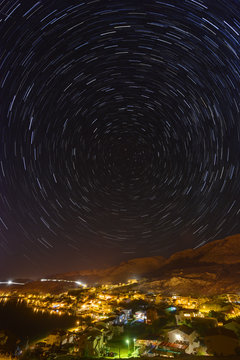 Star trails over the town of Metajna, Pag island, Croatia.