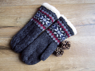 Mittens on wood background