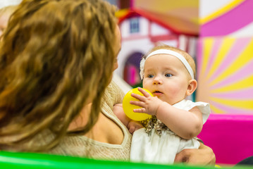 Fototapeta premium mother and child play in the children's room