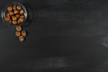 Hazelnuts in a bowl on the chalkboard.