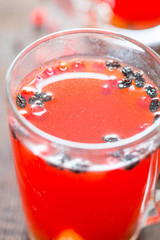 Homemade Hot Spicy Berry Drink on Wooden Table