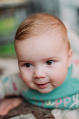 little cute baby toddler on carpet close up smiling adorable happy emotional playing at home