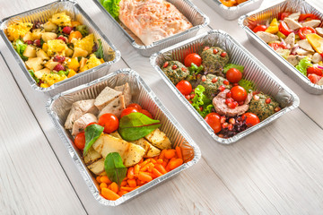 Healthy food take away, top view at wood background