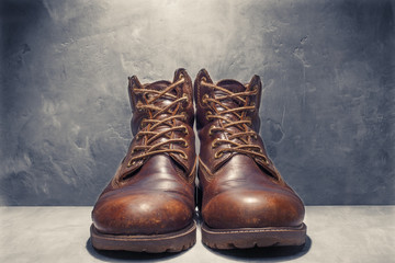 leather shoes on background of concrete wall