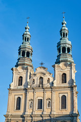 Fototapeta na wymiar Baroque church with bell towers in Poznan.