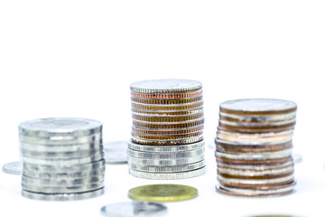 growing money and grow business. silver coin stack isolated on white