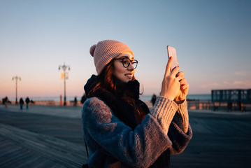 Portrait of a smiling young woman in eyeglasses