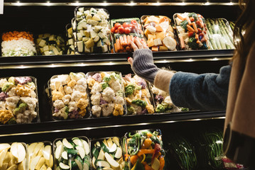 Woman hand shopping for vegetables and fruits