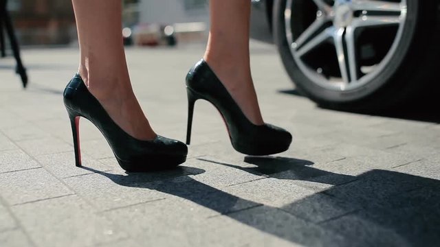 Close-up - The Woman In High Heels Get Out From The Car