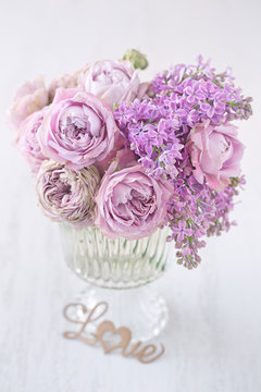 Lovely bunch of flowers .Close-up floral composition with a pink roses on a table. Beautiful bouquet for a birthday or Valentine's Day.Congratulation with a flowers . 
