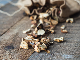 Forest Dried Mushrooms closeup Rustic Wooden background. Side View