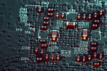 Black electronic circuit background, close up microchip.