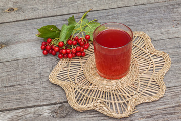 Drink of the viburnum on a wooden background