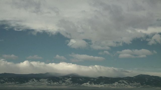 Turbulent Clouds Move Different Directions over Mountains