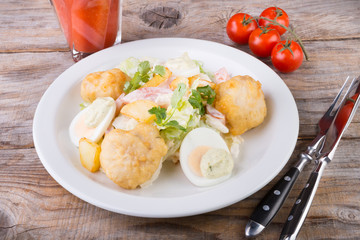 Caesar salad served on wooden table
