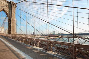 Empty Brooklyn Bridge footpath in the morning sunlight, New York