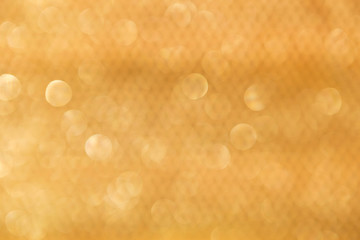 Abstract blurred gold pattern and bokeh background