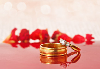 Close up romantic wedding ring with red celebration background