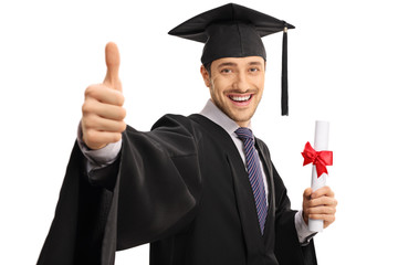 Happy graduate student giving thumb up and holding diploma
