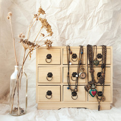 Vintage bronze jewelry on a jewellery storage box