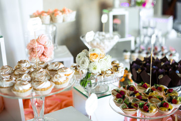 Delicious baked baskets with cream and fruits served on candy ba
