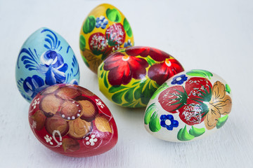 easter concept/hand made peinted eggs on a white wooden background