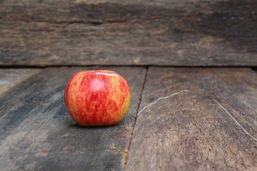 Red Apple  on wood background