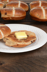 toasted hot cross bun with butter