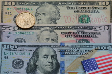 Obraz na płótnie Canvas Dollar banknote and coin with USA flag