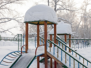 Playground covered with snow in a sanatorium