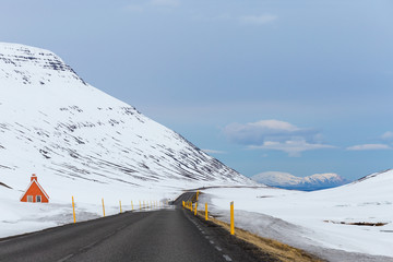 Mountain pass scenery with road winding through snowy scenic route