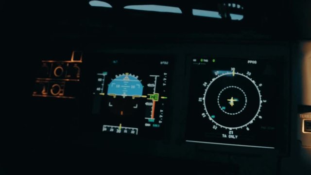 Close shot and panorama of aircraft cabin or cockpit with EFIS. Flight deck centre panel with primary flight display and navigation display, aircraft commander and co-pilot panels. Interior of Airbus