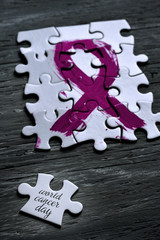 pink ribbon and text world cancer day