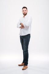 Handsome young bearded man isolated over white background.