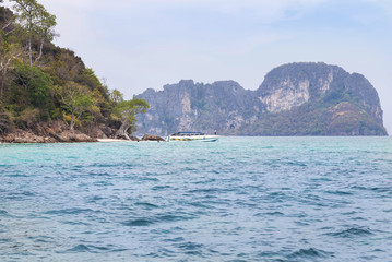 tourist boat moored in the tropical sea during tourists diving