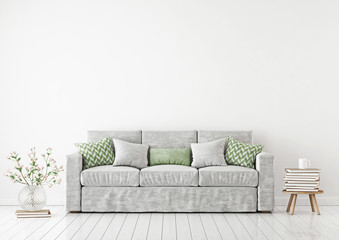 Empty white wall mockup with sofa, pillows, books and flowers in vase. 3D rendering.