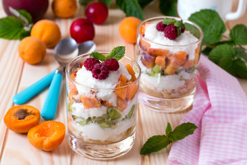 Fruit salad in glass bowl, isolated on white