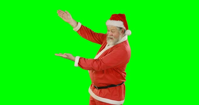 Happy santa claus gesturing on green screen during christmas 4k